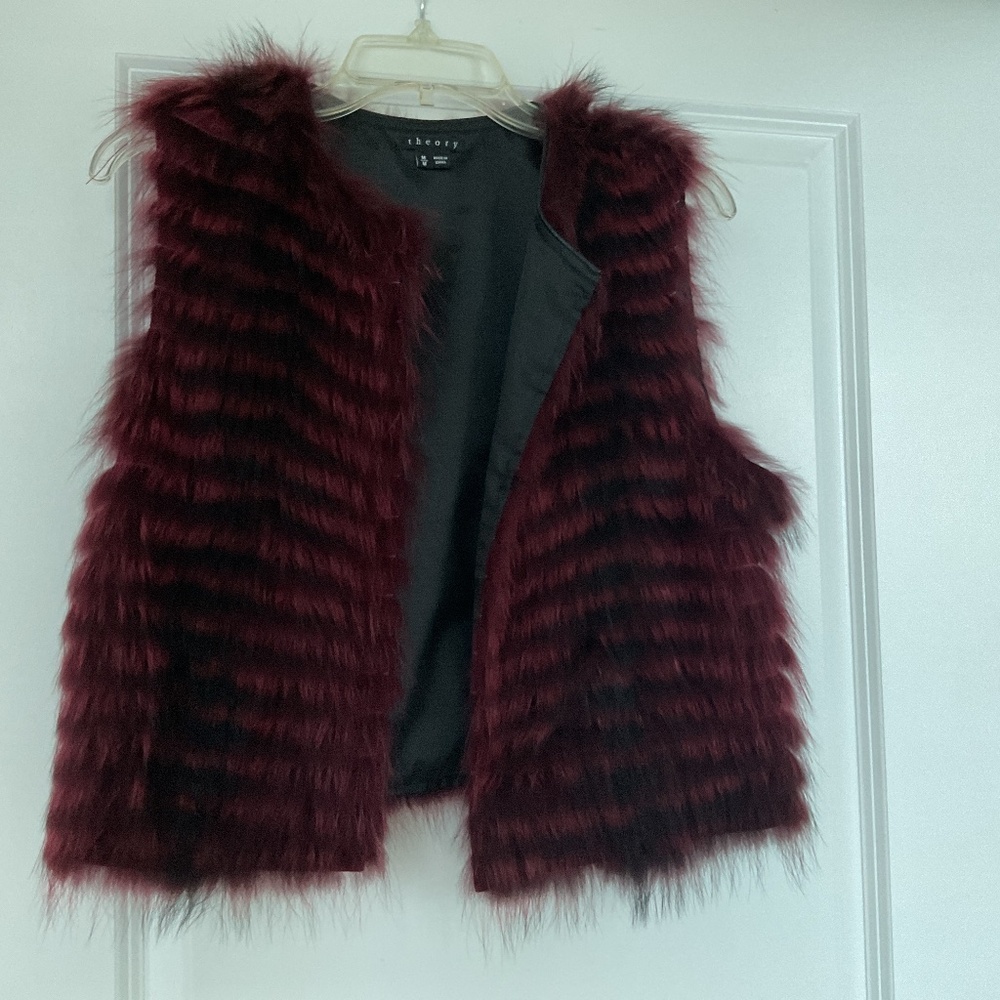 Brand new Real fur designer’s vest size Medium color maroon.
